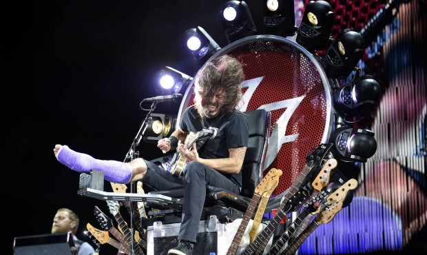 FILE – In this July 4, 2015 file photo, The Foo Fighters’ Dave Grohl performs with a ca...