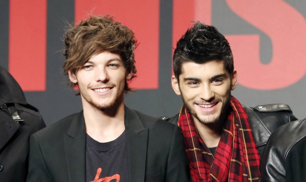 FILE – This Nov. 3, 2013 file photo shows One Direction members Louis Tomlinson, left, and Za...