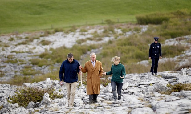 Britain’s Prince Charles, center, talks with Bridget Barry, right, Burren BEO trust and Dr Br...