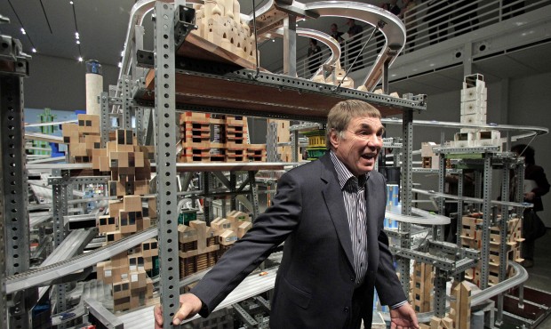 FILE – In this Jan. 11, 2012 file photo, pop artist Chris Burden poses for photos in front of...