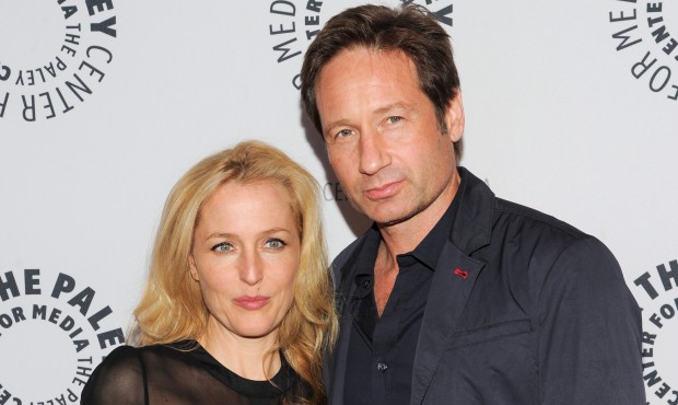 FILE – In this Oct. 12, 2013 file photo, actors Gillian Anderson and David Duchovny attend &q...