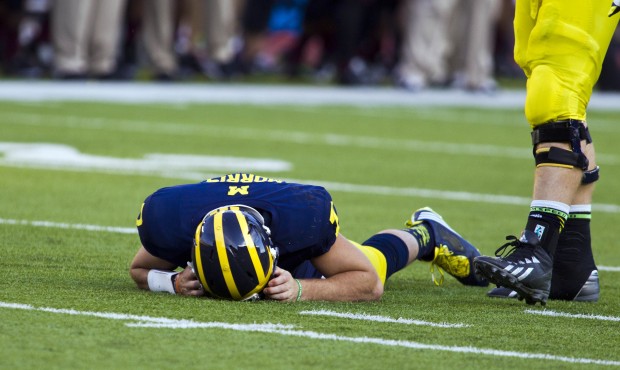 In this Sept. 27, 2014, photo, Michigan quarterback Shane Morris lays on the field after taking a h...