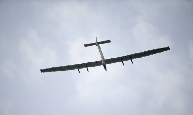 The Solar Impulse 2, a solar-powered airplane, circles the Kalaeloa Airport, Friday, July 3, 2015, ...