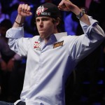 John Racener raises his arms to the crowd before competing against Johnathan Duhamel at the final table of the World Series of Poker, Monday, Nov. 8, 2010, in Las Vegas. (AP Photo/Isaac Brekken)