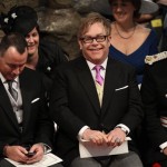 British musician Elton John, centre, and partner David Furnish, left, attend the wedding service for Britain's Prince William and Kate Middleton at Westminster Abbey, London, Friday April 29, 2011. (AP Photo/Adrian Dennis, Pool)