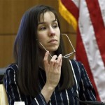 Jodi Arias removes her glasses for a moment while on the witness stand in Maricopa County Superior Court, Wednesday, Feb. 13, 2013, in Phoenix. Arias stands trial accused of murdering her lover, Travis Alexander, in the shower of his Mesa, Ariz., home in 2008. (AP Photo/Ross D. Franklin, Pool)
