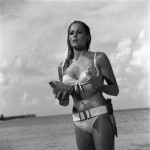 This undated publicity photo provided by United Artists and Danjaq, LLC shows Ursula Andress in a scene from the James Bond 1962 film, "Dr. No." When Ursula Andress emerged from the sea, curves glistening, with a dagger strapped to her bikini in 1962's "Dr. No," she made the Bond girl an instant icon. The film is included in the MGM and 20th Century Fox Home Entertainment Blu-Ray "Bond 50" anniversary set. (AP Photo/United Artists and Danjaq, LLC)