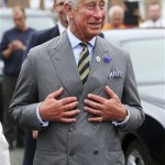 Britain's Prince Charles, the Prince of Wales, gestures during a visit to Bugthorpe, England, Tuesday July 23, 2013. It's Day One of parenting for Prince William and Kate. After the excitement and fatigue and joy of childbirth _ emotions shared with a nation _ the young couple is expected Tuesday to bring the prince home from St. Mary's Hospital in London. Prince Charles is a grandfather for the first time. (AP Photo /Anna Gowthorpe/PA)