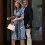 Carole and Michael Middleton, the parents of Kate, Duchess of Cambridge, leave St. Mary's Hospital exclusive Lindo Wing in London Tuesday July 23, 2013 where the Duchess gave birth on Monday July 22. The Royal couple are expected to head to London's Kensington Palace from the hospital with their newly born son, the third in line to the British throne. (AP Photo/Lefteris Pitarakis)