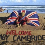 Tourists ride a camel past a sand sculpture created by sand artist Sudarshan Pattnaik to celebrate the birth of the Prince of Cambridge, the son of Britain's Prince William and Kate, Duchess of Cambridge, at a beach in Puri, India, Tuesday, July 23, 2013. (AP Photo)