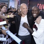 Actor Vin Diesel, left, and actor Tyrese Gibson embrace at the LA Premiere of the "Fast & Furious 6" at the Gibson Amphitheatre on Tuesday, May 21, 2013 in Universal City, Calif. (Photo by Dan Steinberg/Invision/AP)