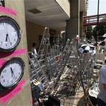 Clocks supposed to show New York and London time which were placed by members of the media are seen across St. Mary's Hospital exclusive Lindo Wing in London, Wednesday, July 17, 2013. Media are preparing for royal-mania as Britain's Duchess of Cambridge plans to give birth to the new third-in-line to the throne in mid-July, at the Lindo Wing. Cameras from all over the world are set to be jostling outside for an exclusive first glimpse of Britain's Prince William and the Duchess of Cambridge's first child.(AP Photo/Lefteris Pitarakis)