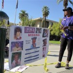 Shirley Johnson, the grandmother of a 5-year-old Arizona girl missing for more than a week, hangs a poster about her disappearance outside the state capitol in Phoenix, Thursday, Oct. 20, 2011. Johnson said she hopes to draw more attention to the disappearance of Jahessye Shockley in hopes of finding the girl alive. (AP Photo/Amanda Lee Myers)