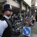Backdropped by members of the media, a British police officer stands across the entrance of St. Mary's Hospital exclusive Lindo Wing in London, Monday, July 22, 2013. Buckingham Palace officials say Prince William's wife, Kate, has been admitted to the hospital in the early stages of labour. Royal officials said that Kate traveled by car to St. Mary's Hospital in central London. Kate _ also known as the Duchess of Cambridge _ is expected to give birth in the private Lindo Wing of the hospital, where Princess Diana gave birth to William and his younger brother, Prince Harry.The baby will be third in line for the British throne _ behind Prince Charles and William _ and is anticipated eventually to become king or queen. (AP Photo/Lefteris Pitarakis)