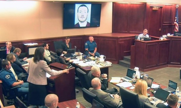 In this image made from Colorado Judicial Department video, defense attorney Tamara Brady, standing...