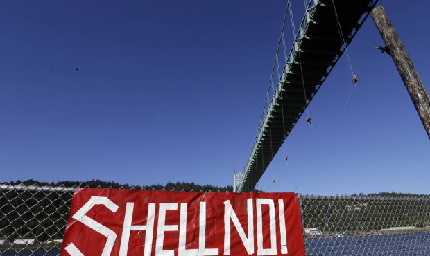 Activists hang from the St. Johns Bridge in Portland, Ore., Wednesday, July 29, 2015, to protest th...