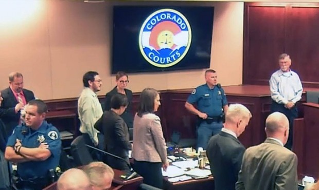 In this image made from Colorado Judicial Department video, Robert Holmes, top right, the father of...